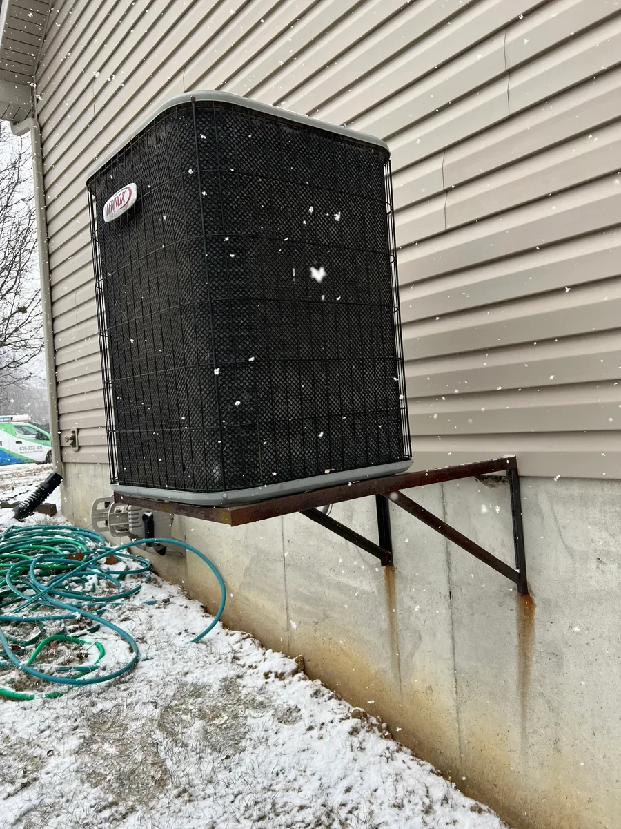 Outdoor air conditioner before replacement in O'Fallon, Missouri.