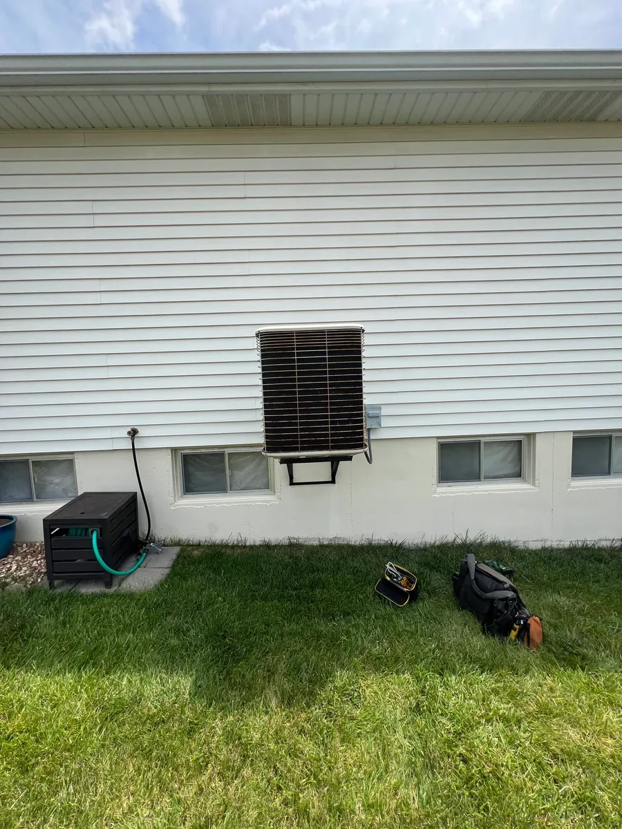 Outdoor air conditioner before replacement in O'Fallon, Missouri.
