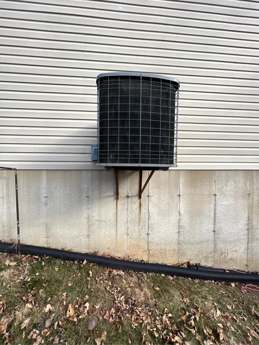 Outdoor air conditioner before replacement in O'Fallon, Missouri.