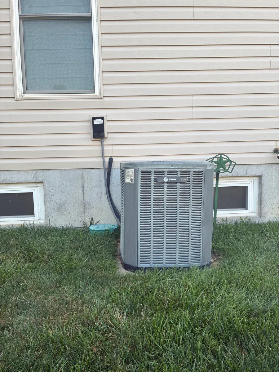 Outdoor air conditioner before replacement in O'Fallon, Missouri.