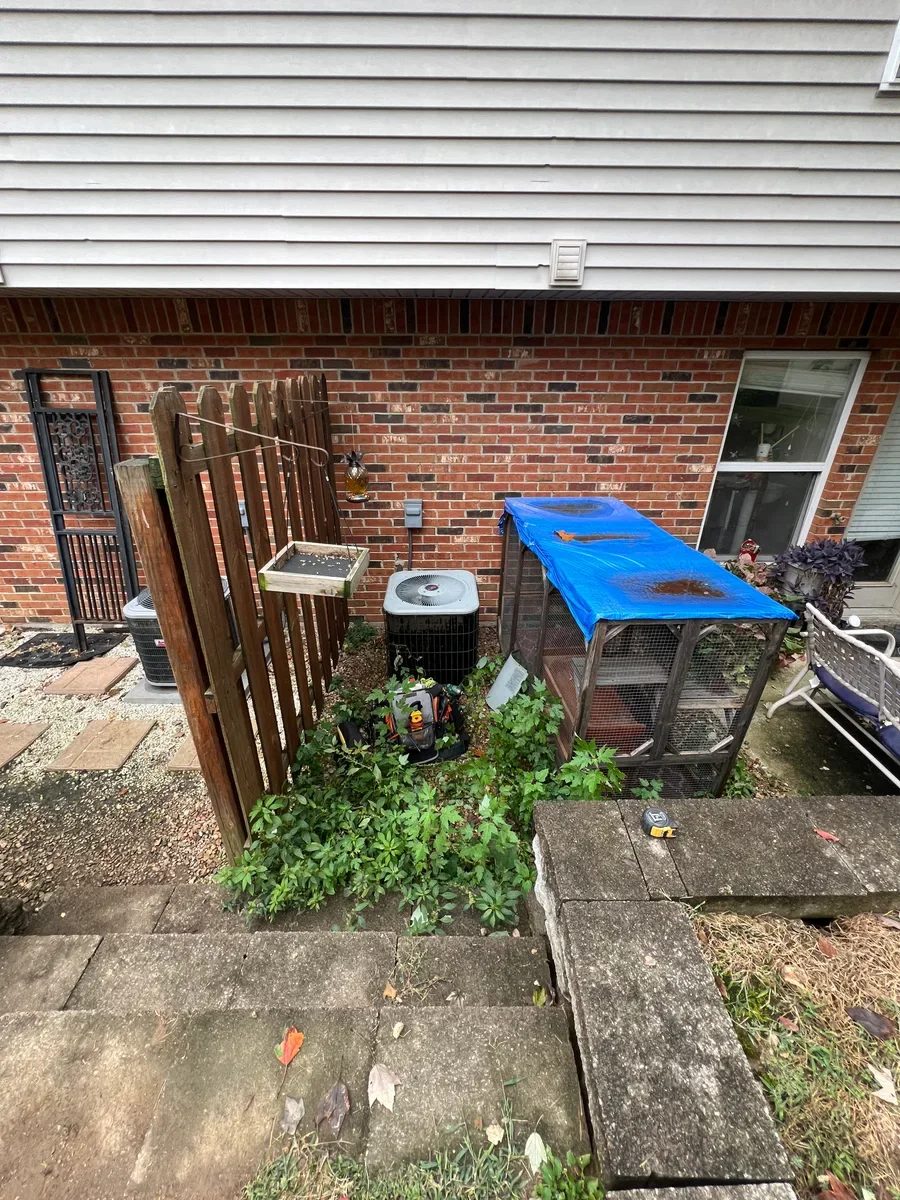 Outdoor air conditioner before a complete heating and cooling system replacement in O'Fallon, Missouri.