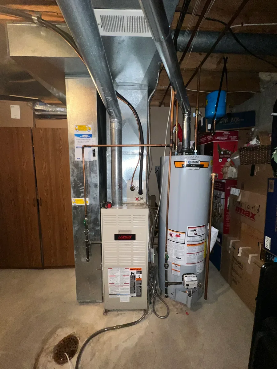 Indoor furnace before a complete heating and cooling system replacement in O'Fallon, Missouri.