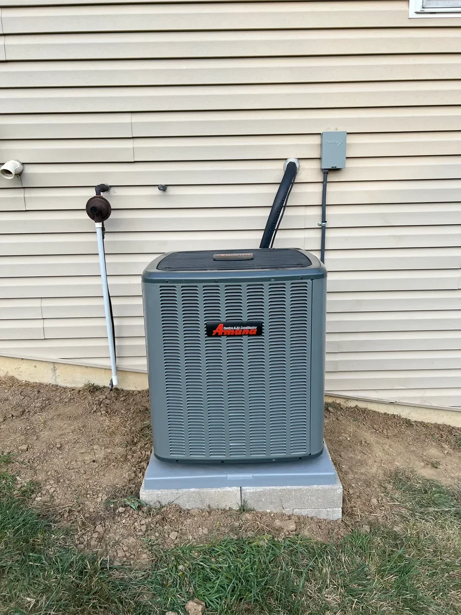 Completed outdoor equipment installed by KirbnJays for a heating and cooling system replacement in O'Fallon, Missouri.