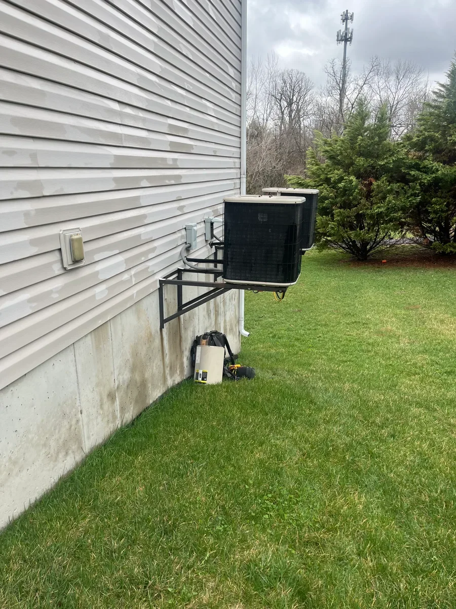 Outdoor equipment before a heating and cooling system replacement in O'Fallon, Missouri.