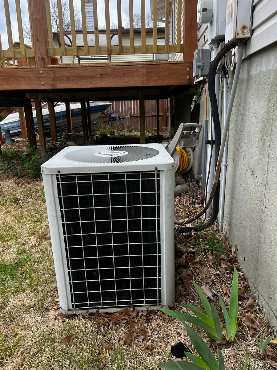 Outdoor air conditioner before replacement in St. Peters, Missouri.